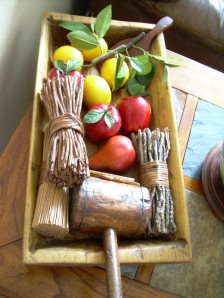Nonna decorates an antique trough with lemons and rustic finds.